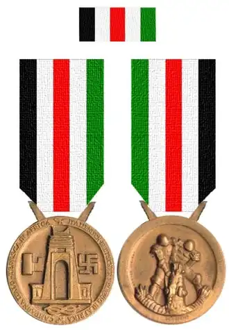 De herinneringsmedaille voorzijde en achterzijde.