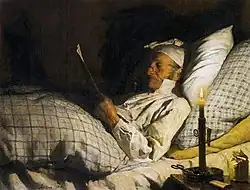 Boer in bed, lezend