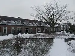 Arbeiderswoningen en middenplantsoen