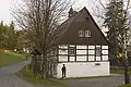 Bräunsdorf, zogenaamd Huthaus van een voormalige mijn, in gebruik als dorpshuis en evangelisch-lutherse kapel