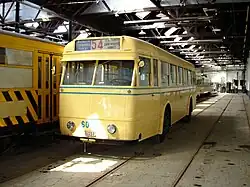 Trolleybus 6023 – bus voor de enige lijn (54) van Brussel die ooit trolleybus was – heeft ook een plekje in het museum. Wegens het ontbreken van tweepolige bovenleiding in Brussel kan hij geen reguliere dienst meer doen, maar hij kan tramlijnen volgen, met één trolleystang op de bovenleiding en een metalen keten achteraan in een tramrail.