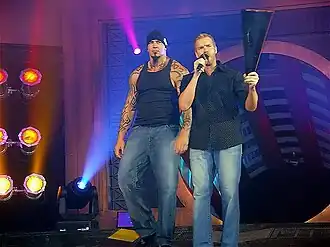 Travis Tomko (links) en Christian Cage (rechts)