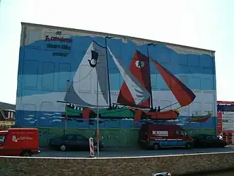 Muurschildering "De Kameleon sleept de Ulbe erdoor"