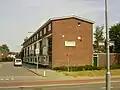 werk-woonhuis: winkelwoningcomplex