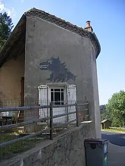 Muurschildering van het Beest in Luc