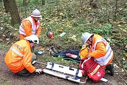 Oefening met een schepbrancard