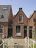Woonhuis, ca. 1900 gebouwd in een traditionalistisch-eclectische bouwtrant.
