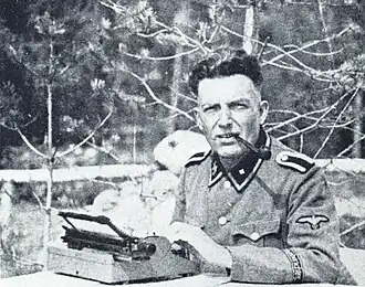 SS-Unterscharführer George Kettmann jr. als SS-Kriegsberichter in Karelië (1943)Groenveld 2004, p.304.