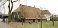 Fraaie boerderij onder hoog, rieten wolfdak "Groot Beetrum"
