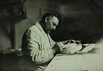 Gustave Van Vaerenbergh aan het werk