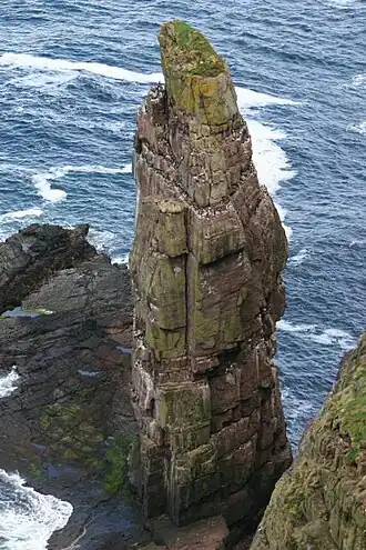 Brandingpilaar voor de kust van Handa