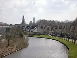 Gezicht op de Hollandse IJssel en IJsselstein, met op de achtergrond de Hervormde Kerk en de Gerbrandytoren.