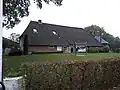 Boerderij met hooiberg en schuur