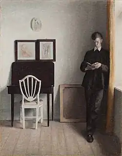 Vilhelm Hammershøi, Interieur met jonge, lezende man, 1898