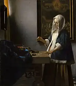 Vrouw met een weegschaal - Johannes Vermeer