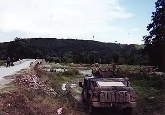 IFOR-troepen in Kosovo, nabij de grens met Macedonië, in oktober 1999.