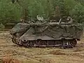 M113 mortiertrekker met camouflagenetten (2004)