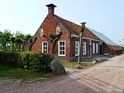 bijbehorende molenaarswoning uit omstreeks 1899