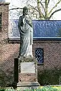 Kerkgebouw Sint-Damianuskerk + beeld, plantsoen en beplanting Sint Damianus