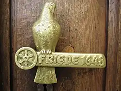 De Deurklink Friede 1648 aan het oude raadhuis (Fritz Szalinski, 1963)