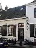 Huis waarvan de lijstgevel een geheel vormt met die van nr 13