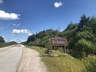 Welkomstbord langs de hoofdbaan