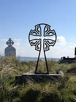 st Quivan's cross in the graveyard of Inis Oírr