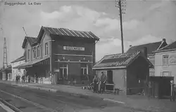 Prentkaart uit begin 20e eeuw met het oude stationsgebouw van Buggenhout