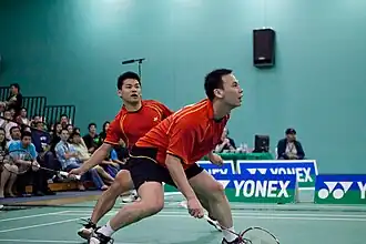 Gunawan (voor) met partner tijdens de US Open Badminton 2011