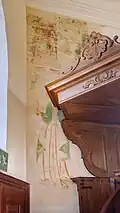 Muurschildering achter de kansel. Het betreft het Laatste Oordeel met eronder de apostel Bartholomeüs en de heilige Christoffel.