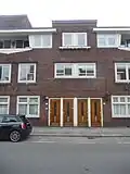 Woningbouwcomplex met 67 etagewoningen in de stijl van de Amsterdamse School