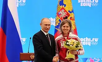 Romanova (rechts) met president Poetin