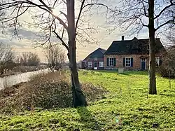 bij houten brug Warmseweg - Kruisallee