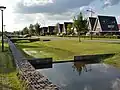 Wadi als gracht in de wijk Bijsteren in Putten, Nederland